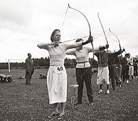Persons shooting bow.